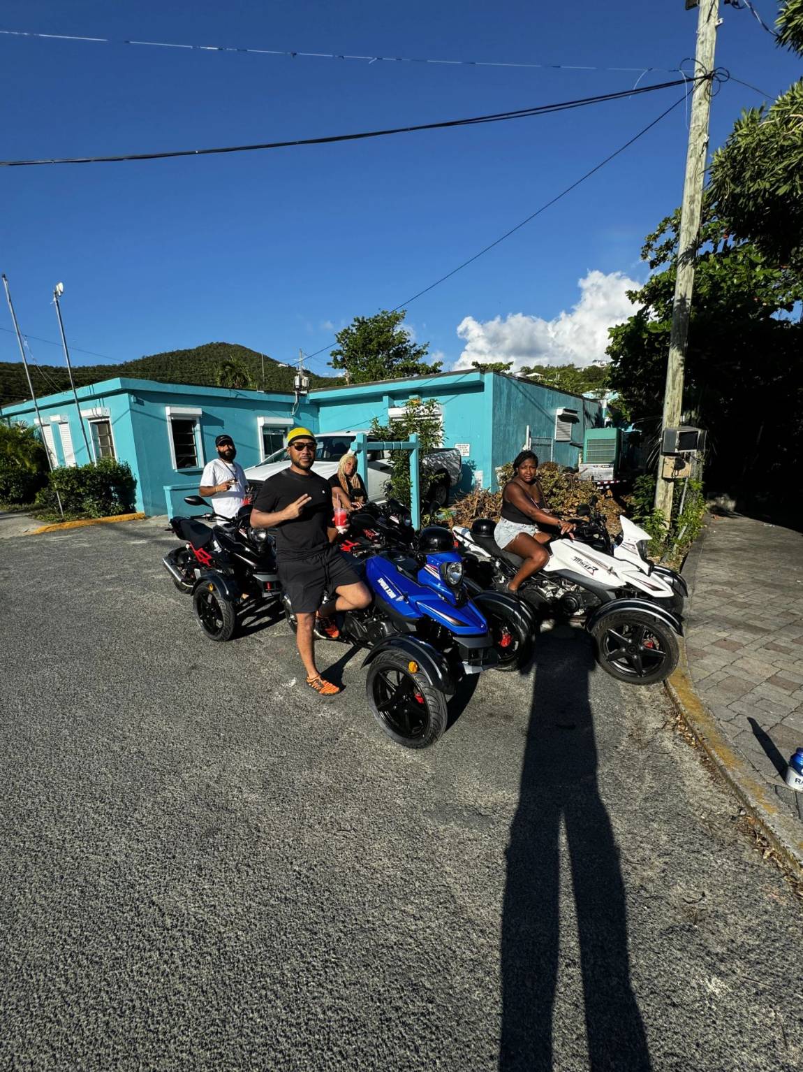 Four guests with their trikes back at home base