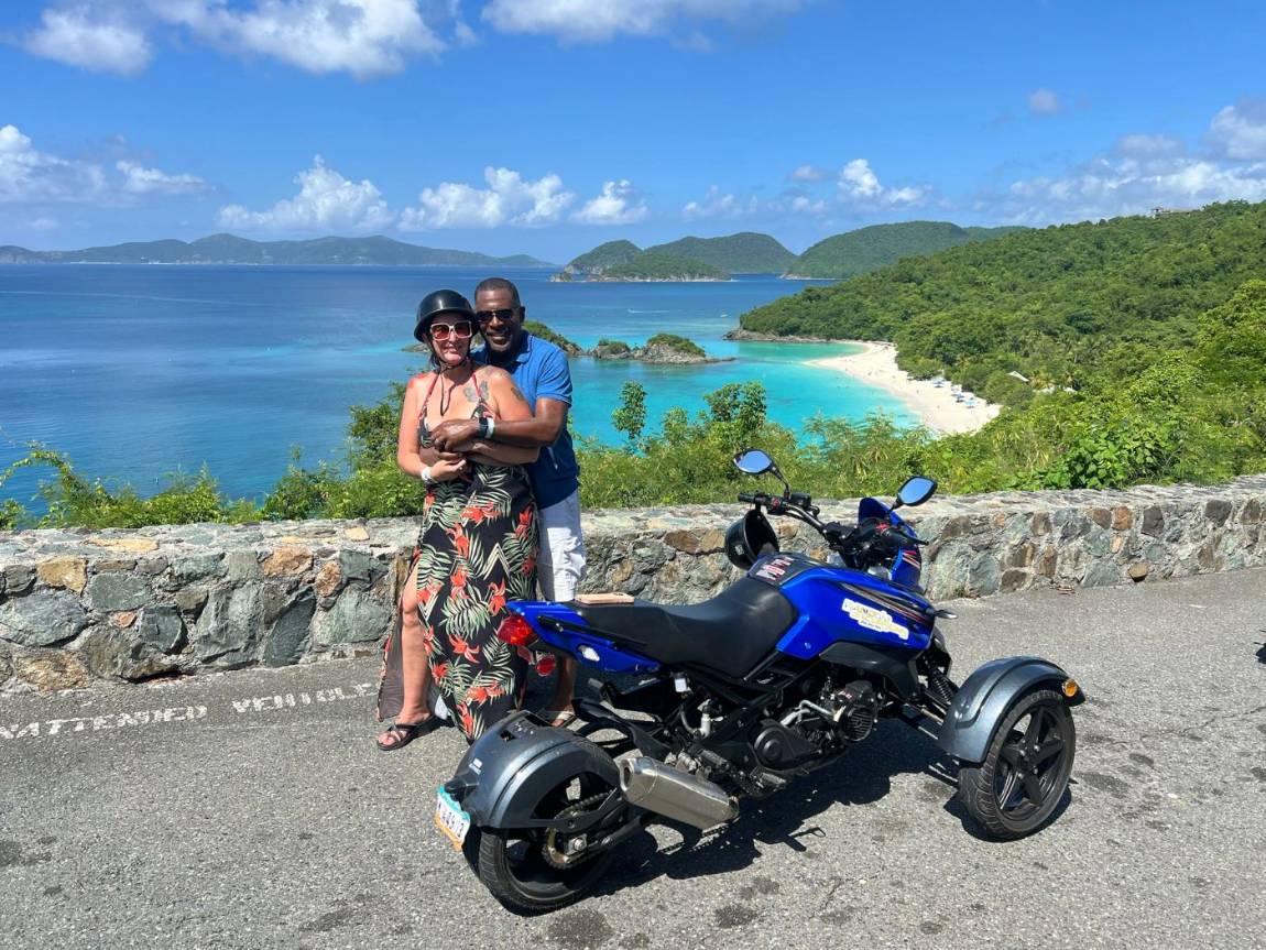 A couple on a trike at the Trunk Bay overlook on St. John