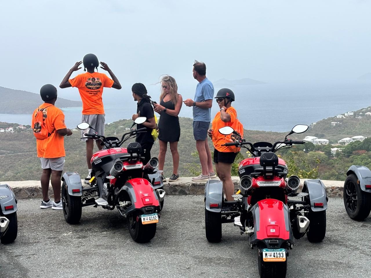 Riders taking in the view at a scenic island overlook